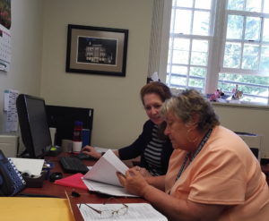 (l) Barkhamsted Registrar of Voters Karen Martin (D) and (r) Susan Day at work